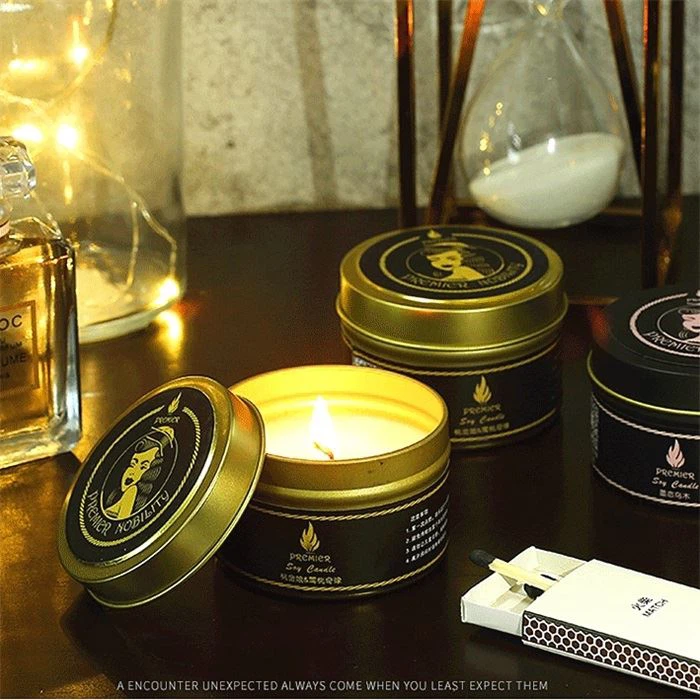 2. Handmade soy wax scented candles in gold and black tin cans.