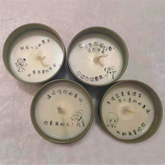 3. Scented soy candles with different custom writings in their wax.
